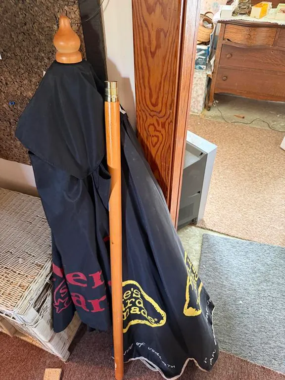 Wood Umbrella Pole and (2) Advertising Umbrellas