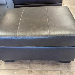 ONSITE: ASHLEY MORELOS GREY LEATHER OTTOMAN