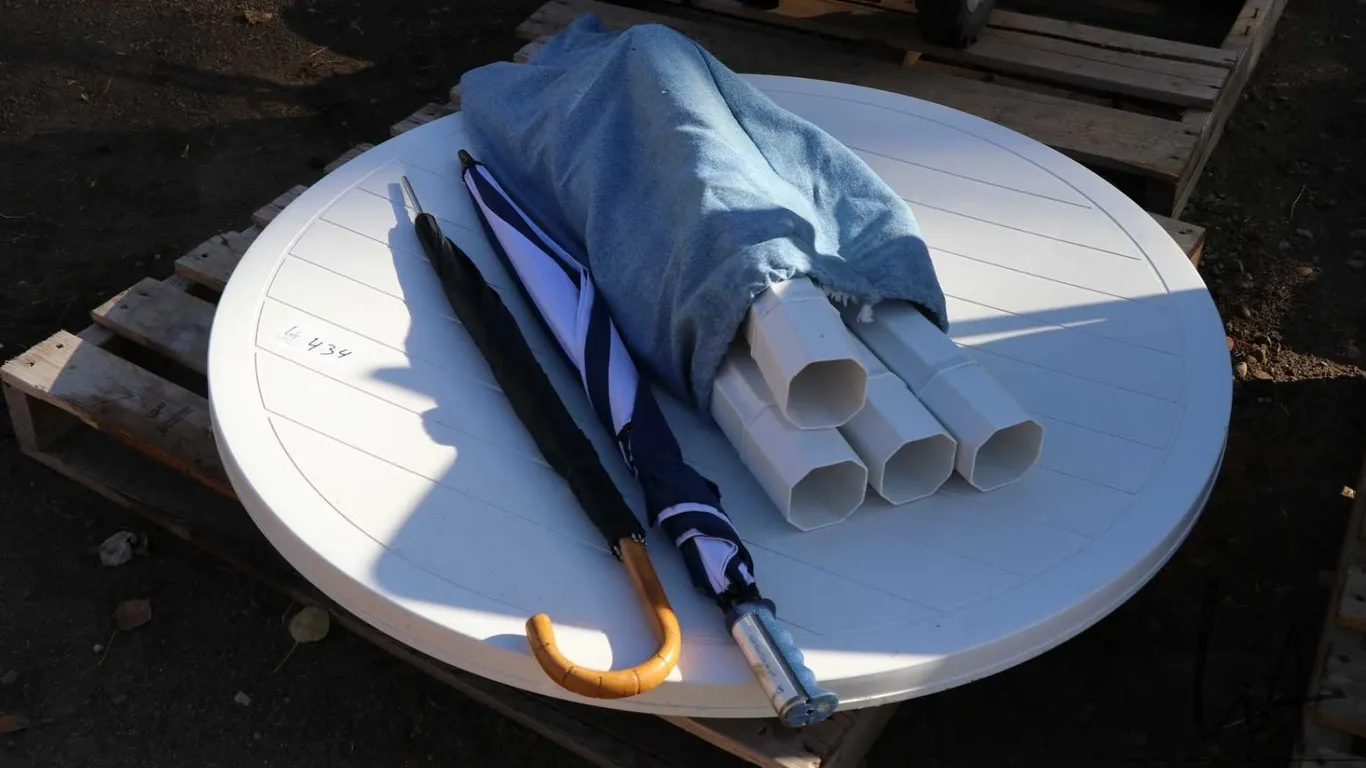 Patio table and two umbrellas.