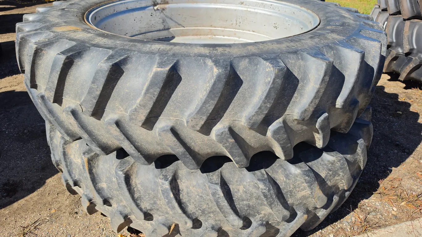 (2) 420/80R46 Firestone Radial All Traction 23 Tires on 10 Bolt Silver Rims off Magnum 7130
