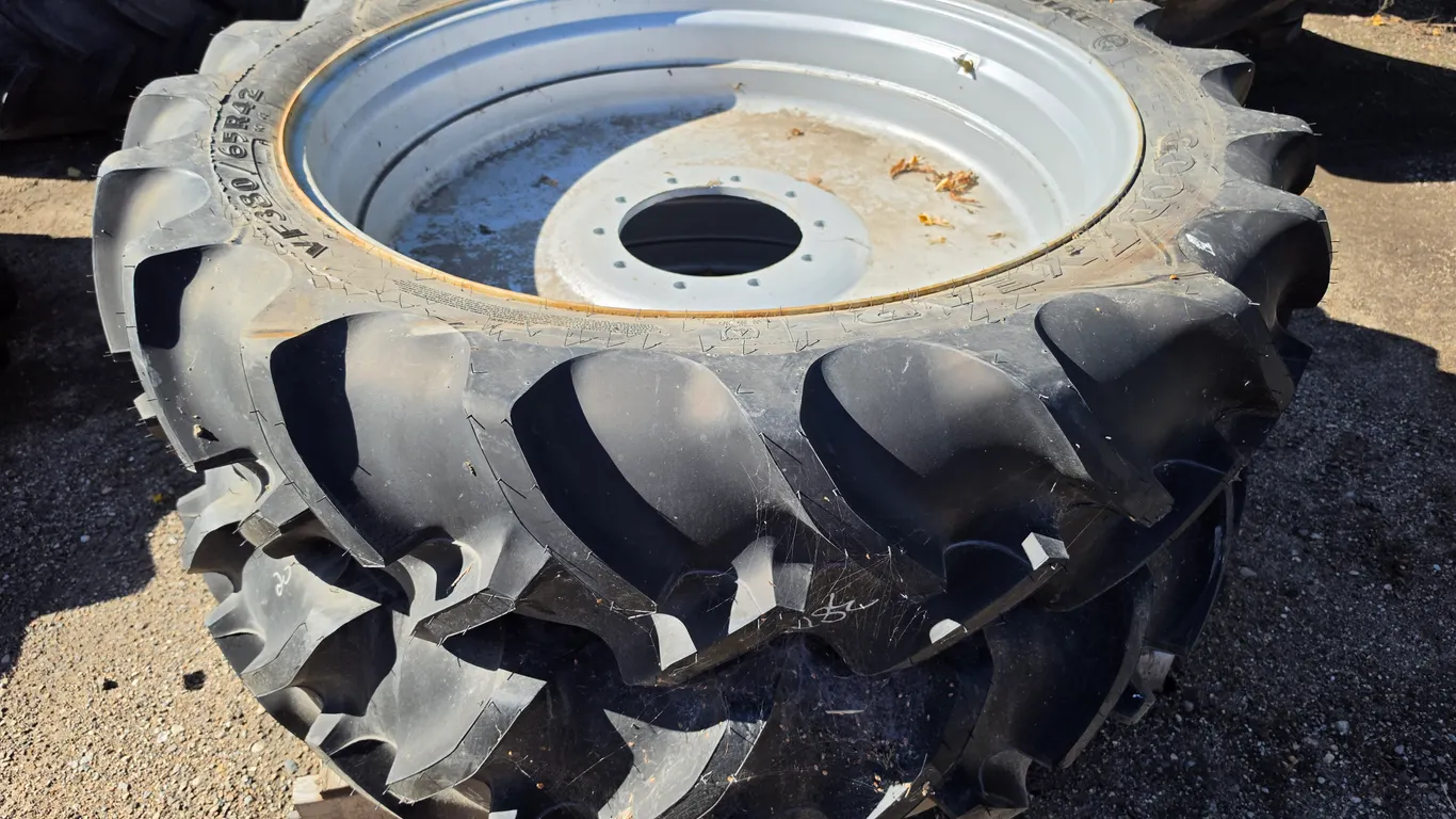 (2) VF380/65R42 Goodyear Super Traction Radial Tires on 10 Bolt Silver Rims