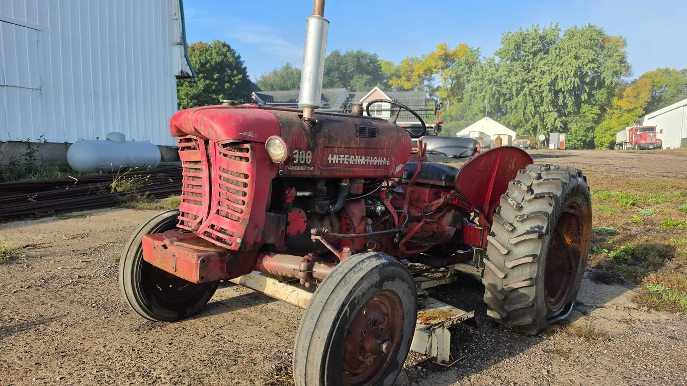 International 300 Utility Tractor with Woods L306 – 6’ Belley Mower, Hydraulic Lift on Mower, 13.6-2