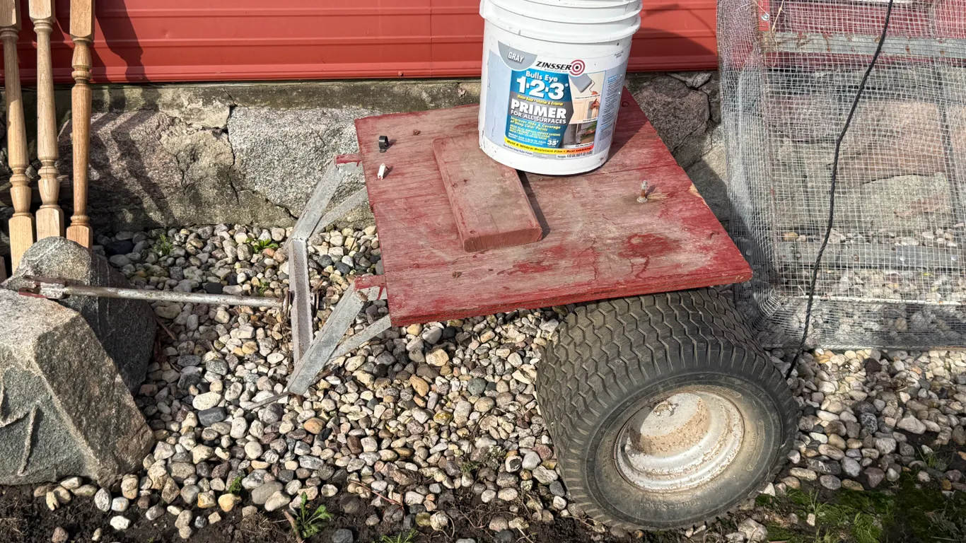 Small Pull-Type 2 Wheel Trailer With 1/2 5 Gal Pail Of Primer Paint