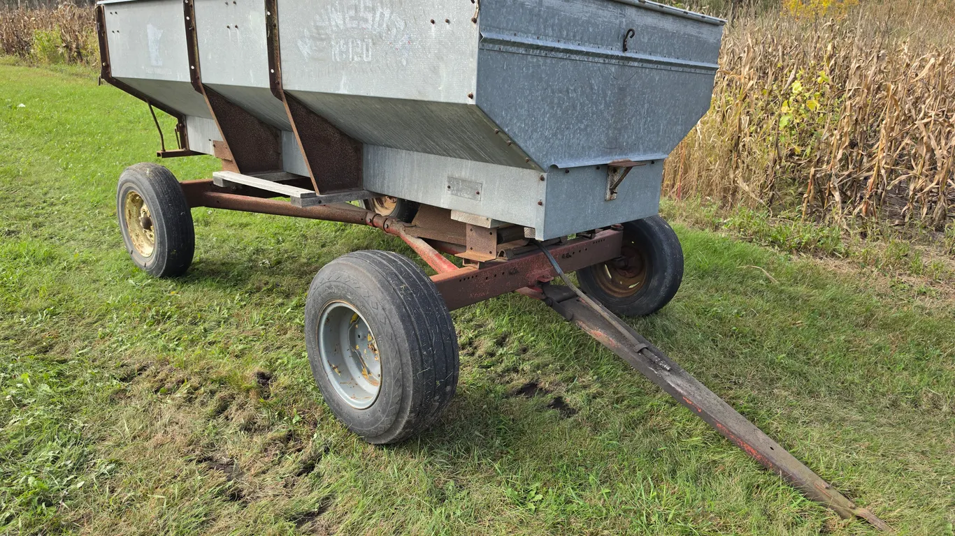 Minnesota No 130 Galvanized Flair Box on Hydraulic Running Gear, Wood Floor, 15” Tires