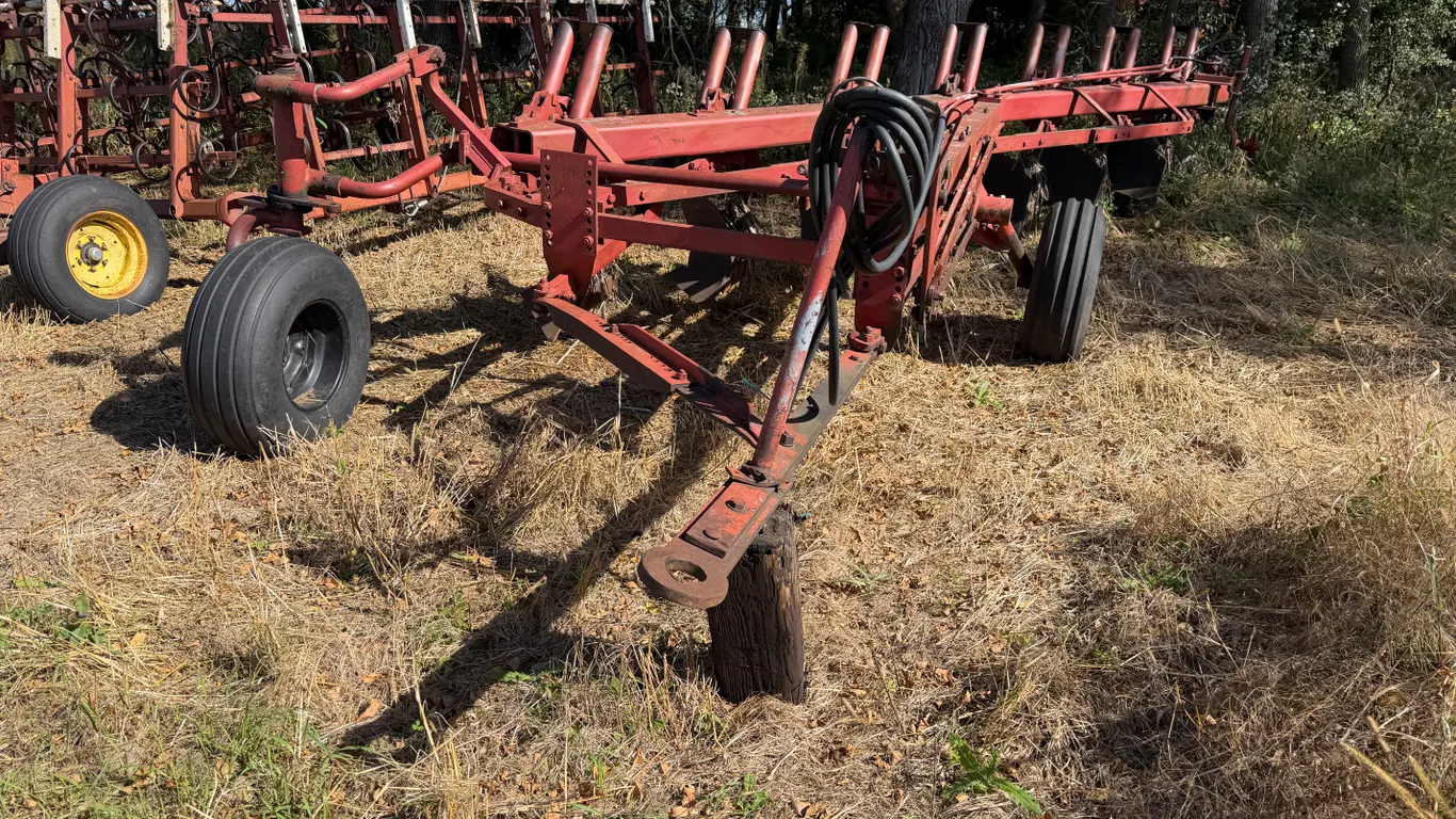 International 7 Bottom Plow, Missing a Wheel, Otherwise in Working Condition