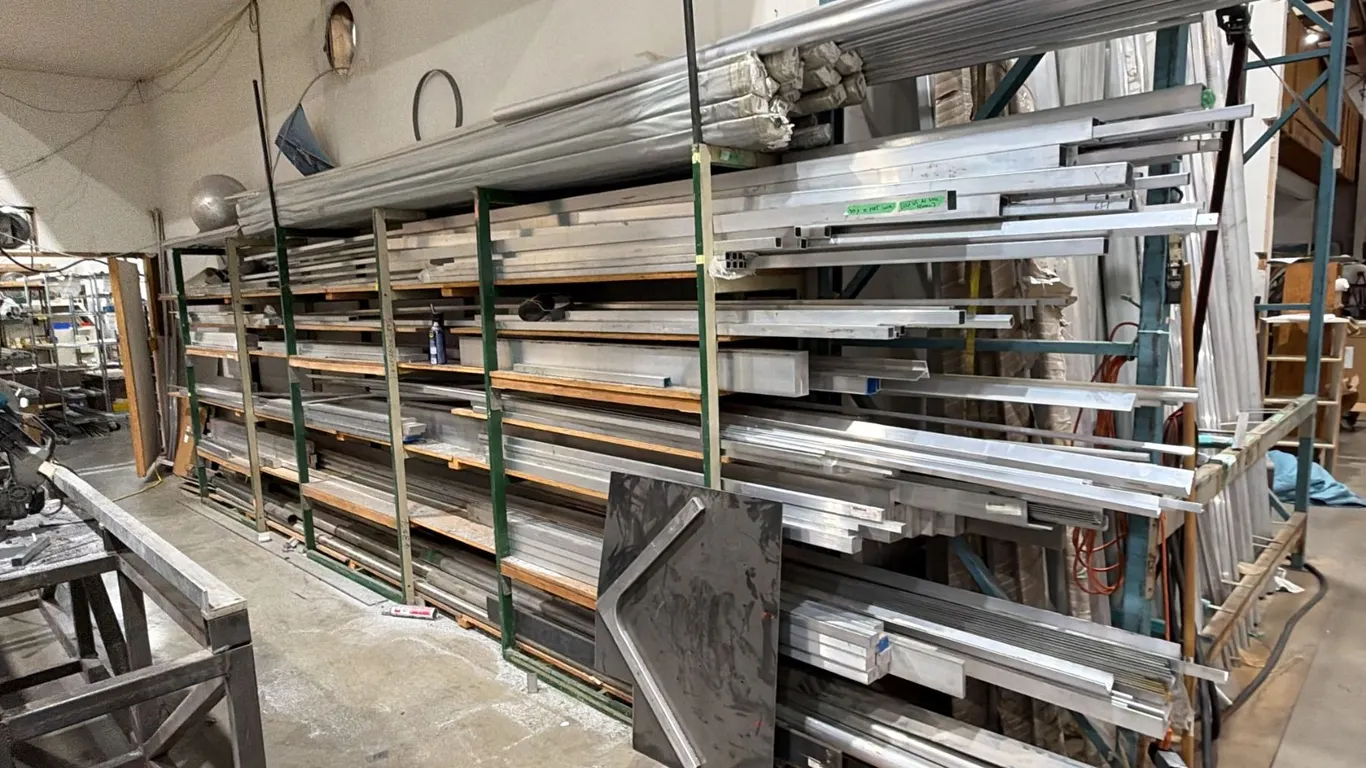 6-TIER SHELVING UNIT WITH ASSORTED ALUMINUM CONTENTS APPROX 24FT IN TOTAL LENGTH WITH ASSORTED SIZE