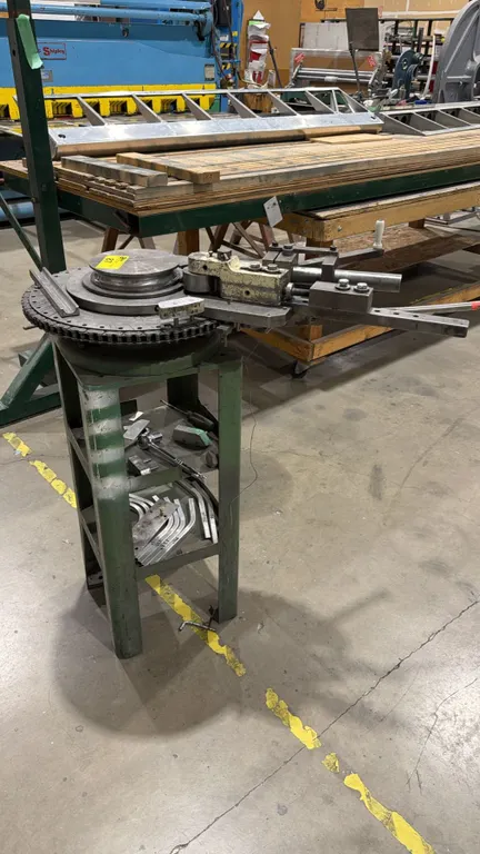 INDUSTRIAL MANUAL ROTARY BENDER MOUNTED ON 2-TIER STEEL STAND WITH ASSORTED CONTENTS