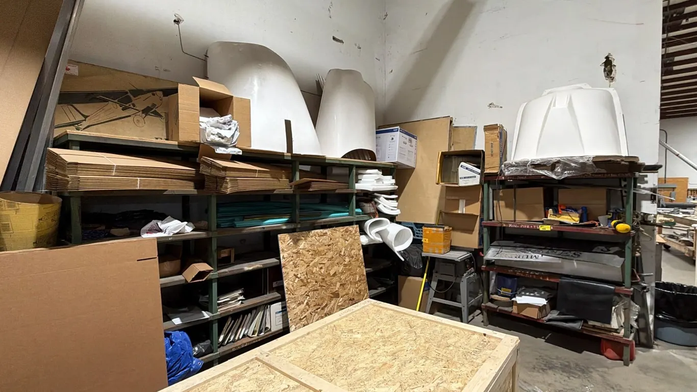 CORNER OF ASSORTED ITEMS INCLUDING; CRAFTSMAN TABLE SAW, STEEL SHELVING UNITS WITH CONTENTS,