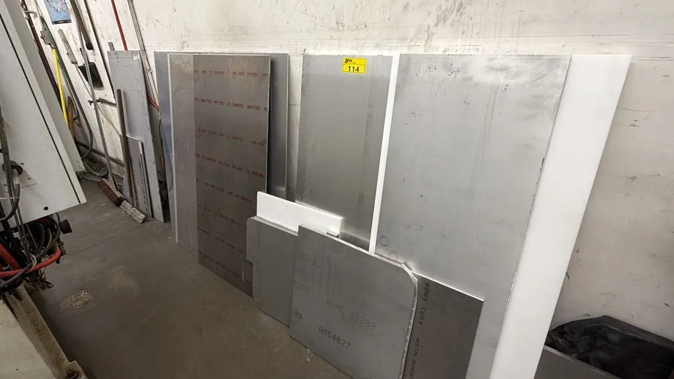 SECTION OF ASSORTED SIZE & SHAPE ALUMINUM PANELS