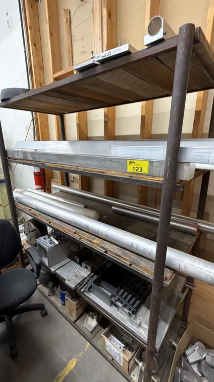 4-TIER METAL SHELVING UNIT WITH ASSORTED CONTENTS INCLUDING; ALUMINUM RODS, POSTS & PANELS, LATHE