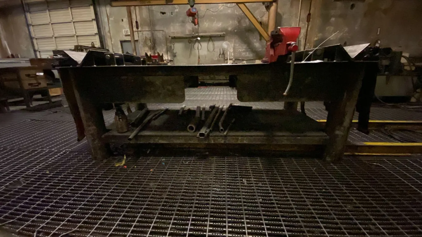 CUSTOMIZED HEAVY STEEL WORK TABLE WITH VISE, RATCHET TIE DOWNS, 2 DRAWERS FULL OF NUTS & HARDWARE