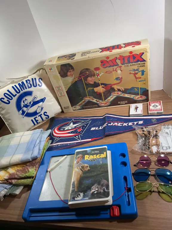 Lot: Air Trix Game, Sunglasses, Blue Jackets Items