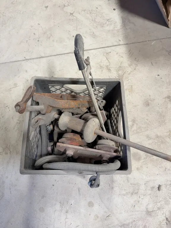 Crate of dent pullers and pulleys