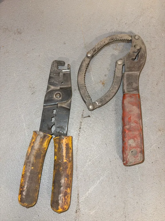 Oil filter wrench and wire strippers