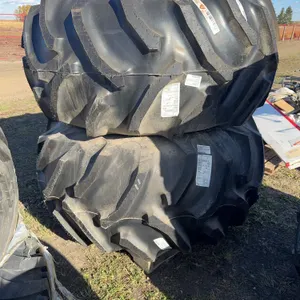 UNUSED 2 tires/rims 28L-26