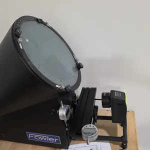 Fowler 53-900-000 optical comparator. Features a 10X projection lens, rotary protractor screen with chart clips, profile and surface illumination, and