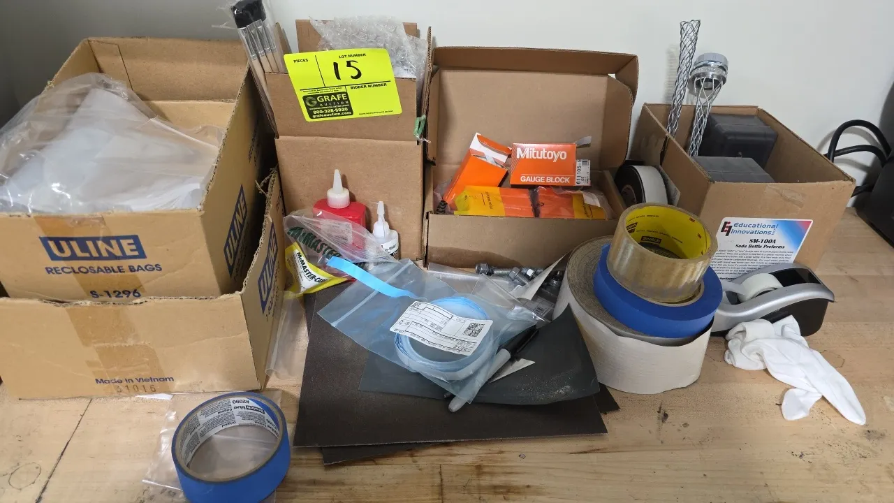 Assorted shop and packaging supplies. Lot includes Mitutoyo gauge blocks, Uline reclosable poly bags, assorted adhesive tape rolls, desktop tape dispe