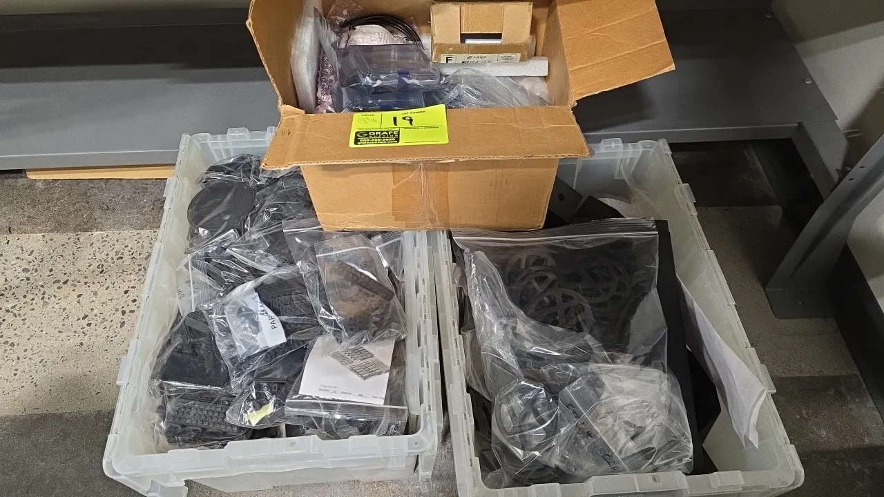 Assorted thermoplastic production parts. Lot includes (2) clear plastic storage totes and (1) cardboard box containing various bagged thermoplastic an