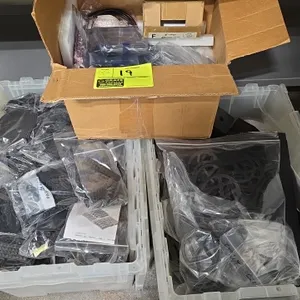 Assorted thermoplastic production parts. Lot includes (2) clear plastic storage totes and (1) cardboard box containing various bagged thermoplastic an