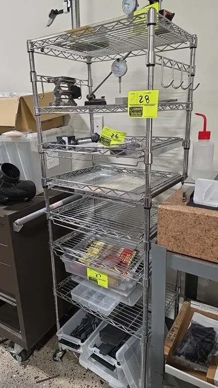 Chrome 8-tier portable wire shelving cart. Features (4) slide-out shelves, fixed wire shelves, and hanging hooks. 21" x 15" x 61.5". Mounted on caster