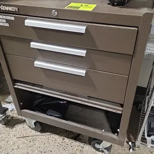 Kennedy metal 3-drawer portable tool cabinet. Features brown wrinkle finish, 3 pull-out drawers, bottom storage compartment with fold-away panel, and 