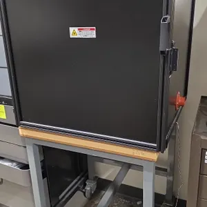Thorlabs optical breadboard enclosure cabinet. Features aluminum extrusion construction, laser safety warning label, and internal Thorlabs optical bre