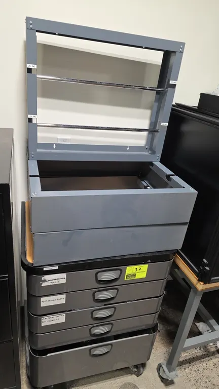 Metal portable 5-drawer tool cabinet with contents and metal spool rack. Features 5 pull-out drawers and top surface. Includes assorted hand tools, ta