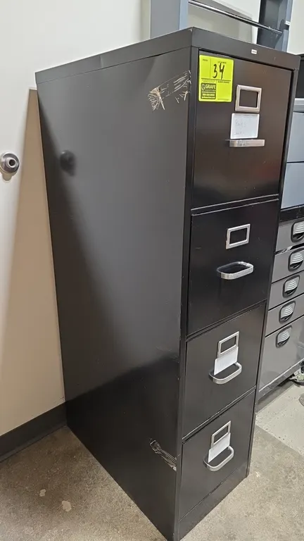 Hon 4-drawer metal vertical file cabinet with contents. Features black finish, 4 drawers with label holders, and pull handles. Includes drawer content