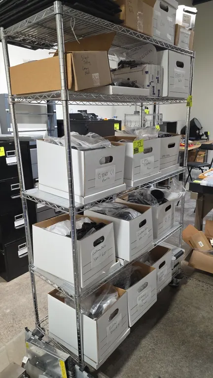Chrome 5-tier wire shelving unit. Features (5) adjustable wire shelves. 48"W x 18"D x 77"H. Mounted on casters with donut bumpers. Contents not includ