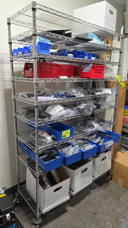 Chrome 9-tier portable wire shelving unit. Features (9) adjustable wire shelves. 48"W x 18"D x 77"H. Mounted on casters. Contents not included.