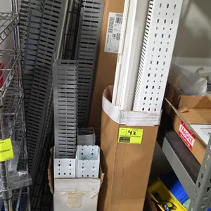 Assorted plastic slotted wiring duct and raceway lot. Includes various lengths of gray and white slotted cable management raceways and channels by bra