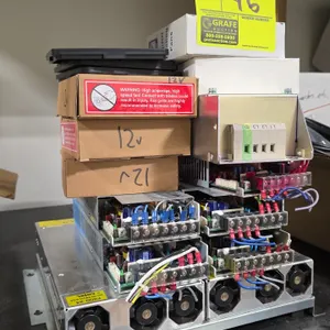 Assorted power supplies, cooling fans, and electrical components. Includes an Allen-Bradley 25-RF027-CL EMC line filter, Cosel UAF500S-24 power suppli