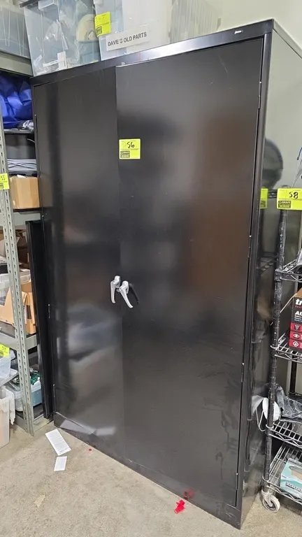 Tennsco 2-door metal storage cabinet. Features dual door handles, multi-tier interior shelving, and black finish. 48" x 24" x 78". Includes assorted s