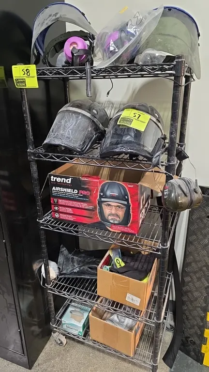 Black coated 5-tier portable wire shelving unit. 24" x 14" x 58". Mounted on casters. Contents not included.