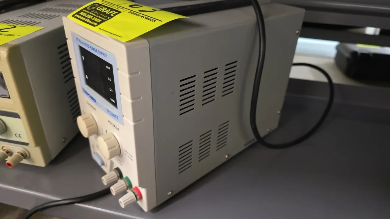 Tekpower TP3005T DC regulated power supply. Features digital LED display, adjustable voltage and current rotary controls, and front-panel output bindi
