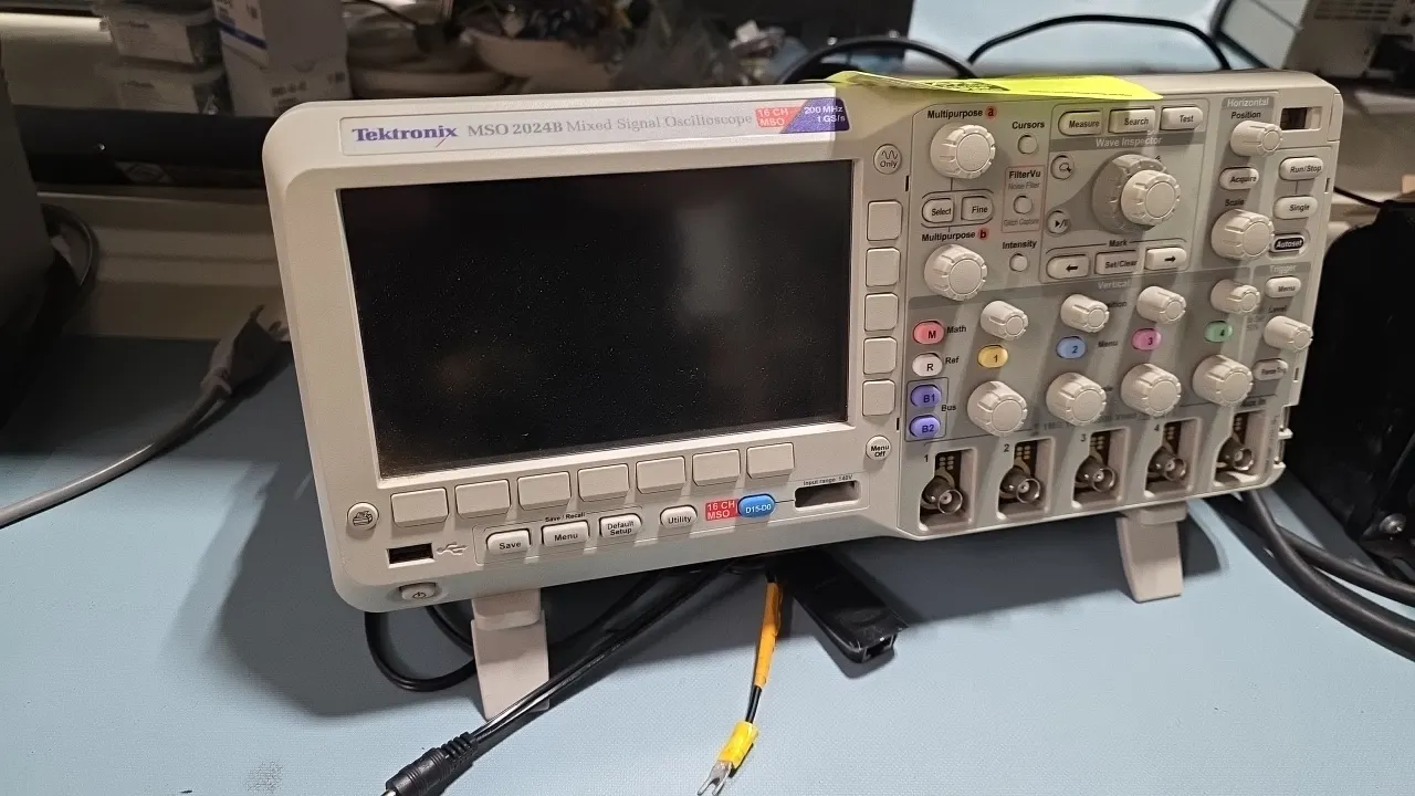 Tektronix MSO 2024B mixed signal oscilloscope. Features 4 analog channels, 16 digital channels, 200 MHz bandwidth, and 1 GS/s sample rate. S/N: C02105