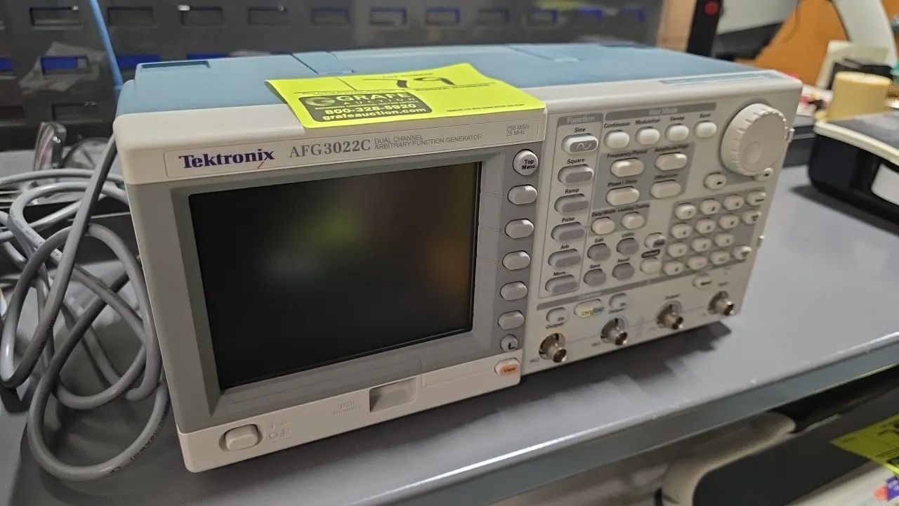 Tektronix AFG3022C dual channel arbitrary/function generator. Features 25 MHz bandwidth, 250 MS/s sample rate, front display, USB memory port, and rea