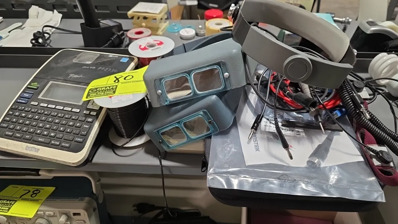 Electronics workbench accessories lot. Includes Brother PT-2730 P-touch label maker, (2) adjustable headband magnifiers, spools of wire including Dabu