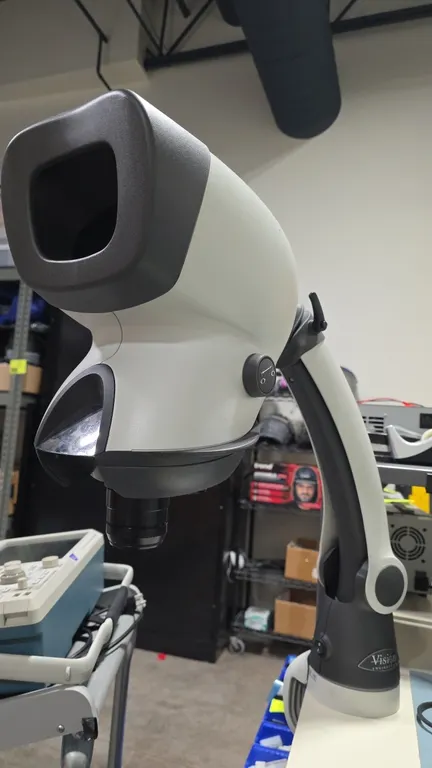 Vision Engineering Mantis Elite eyepiece-less stereo microscope. Features 10x objective lens and integrated LED illumination. Articulated arm stand wi