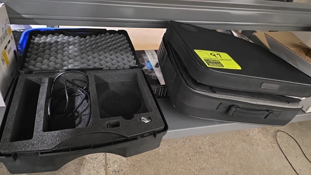Assorted equipment carrying cases. Includes hard molded plastic protective case with foam interior and soft-sided zippered carrying cases.