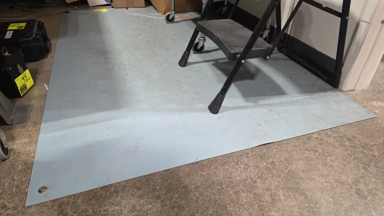 Electrostatic discharge (ESD) floor mats. Features corner grounding snaps and grounding cord. 47.5" x 72". Contents not included.