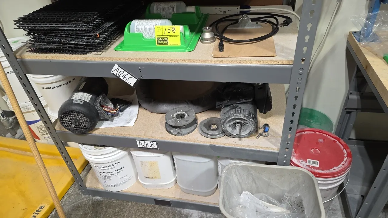 Maintenance and facility supply lot. Includes (2) electric motors with disassembled parts, bottle eye wash station, clipboard, wire grates, box of Uli