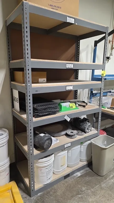 Uline metal shelving unit. Features 6-tier adjustable particle board shelves and gray steel frame. 48" x 24" x 84". Contents not included.