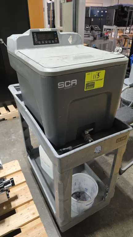PADT SCA-1200HT support cleaning apparatus. Features digital temperature and timer control panel, top access lid, and front drain valve. S/N: 8120414.