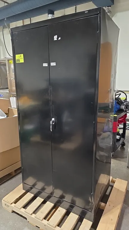 Tennsco 2-door metal storage cabinet. Features double doors with locking handle and four adjustable interior shelves. 36"W x 24"D x 72"H. Note: heavy
