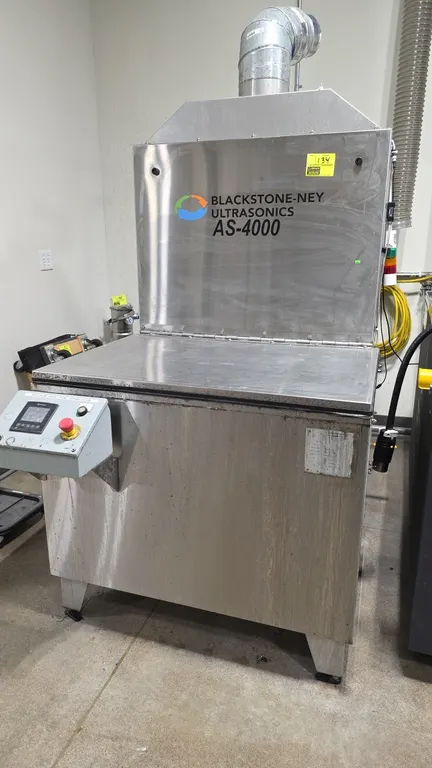 Blackstone-Ney Ultrasonics AS-4000 ultrasonic cleaning system. Features stainless steel construction, hinged lid, digital control panel with emergency