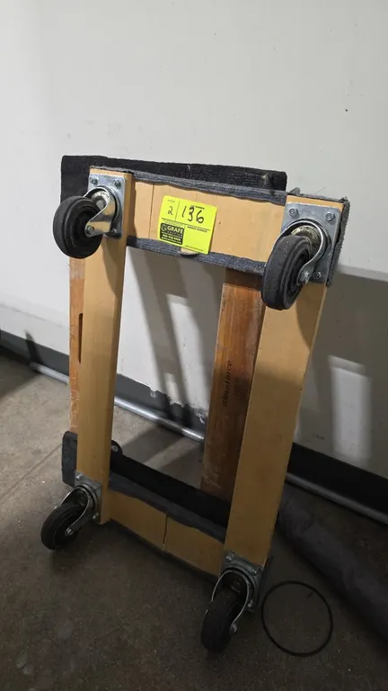 Wood 4-wheel mover's dollies. Features hardwood construction, carpeted ends, and swivel casters.