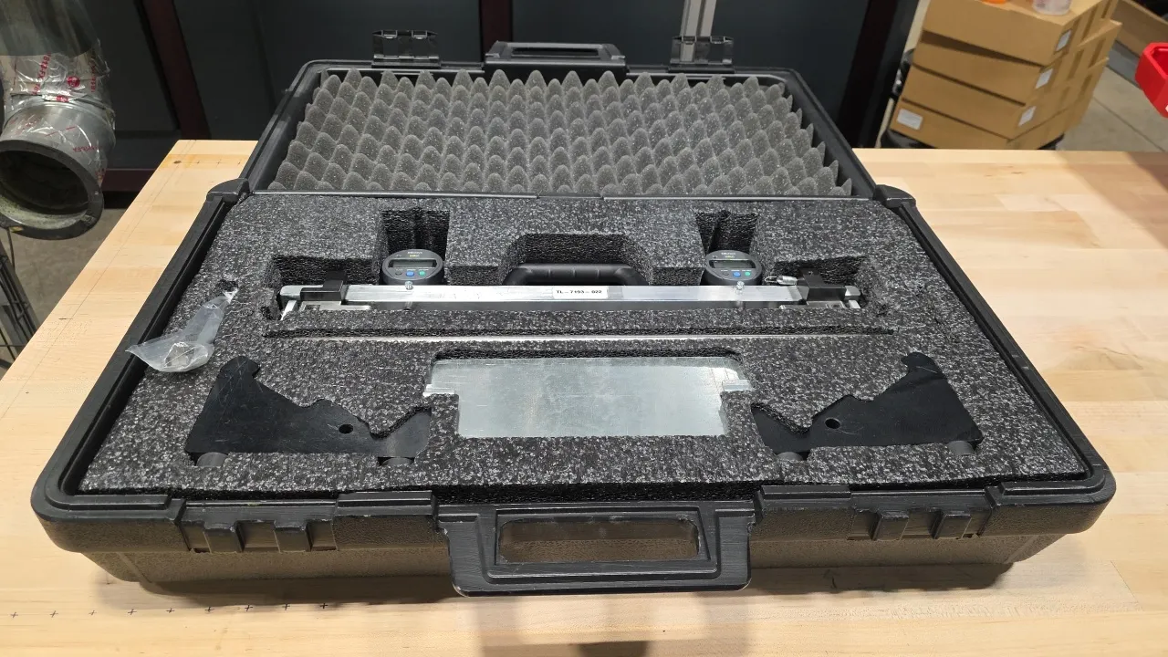 Precision structural alignment gauge assembly, tool no. TL-7193-022. Features dual Mitutoyo digital indicators, aluminum fixture bars, alignment rod,