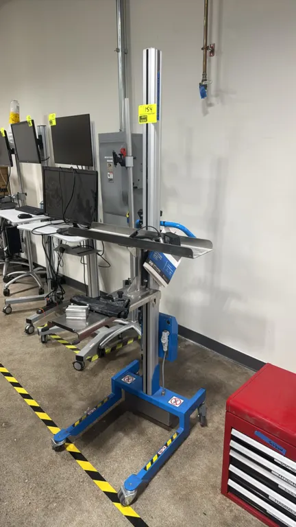 2023 RONI LIFT-N-GO PC electronic portable lift. Features push-button pendant control, stainless steel tray platform, battery charger, and user manual