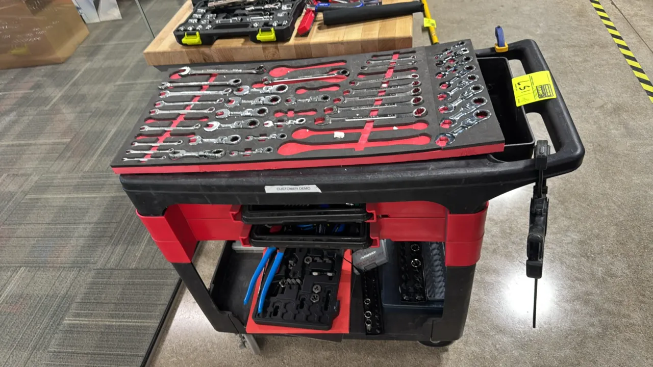 Poly 2-tier service cart. Features integrated push handle. 32" x 18". Mounted on casters. Includes assorted hand tools, foam wrench organizer with Cra